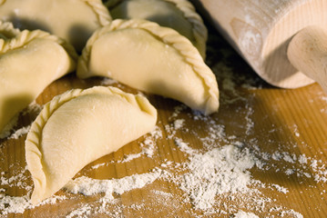 dumplings on the table with flour
