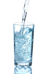 The water flowing in a glass