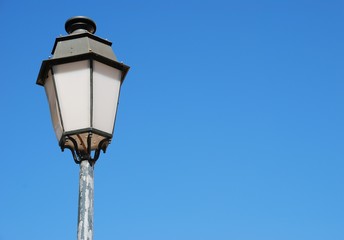 Fototapeta na wymiar Vintage lamp post (blue sky background)
