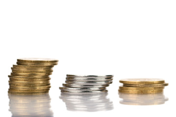 Three columns of coins isolated on white