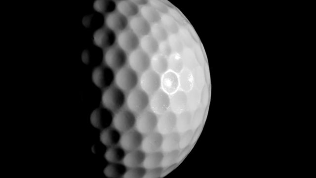 Golf ball isolated against black close up -HD