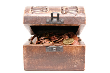 A wooden ancient chest full of money..