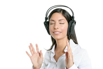 Beautiful brunette businesswoman hearing music