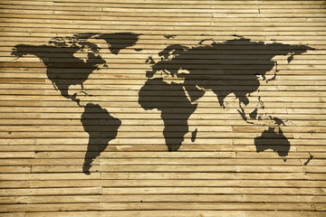 conceptual image of flat world map on wooden background