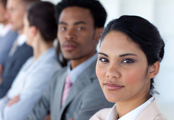 Fototapeta premium Confident businesswoman with her team in a line