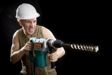 The builder in a protective helmet