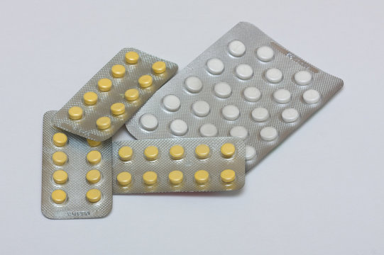 white & yellow pills