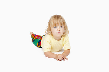 boy lying down, looking at camera