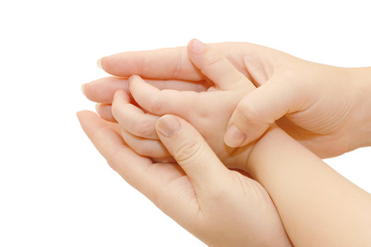 Small children's handles in female hands