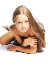 Little girl in the furs as a primitive man