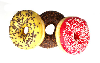 Delicious donuts on white background