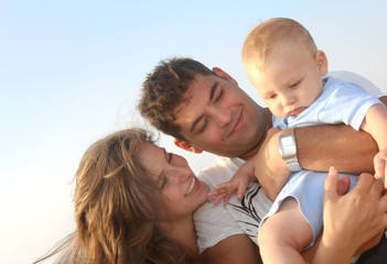 Happy young family with the child