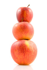 Three stacked apples over white background