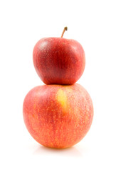 Two stacked apples over white background