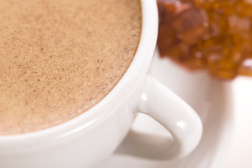 notebook, sugar and cup of coffee
