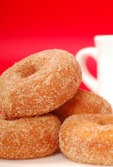 Apple cinnamon doughnuts with coffee