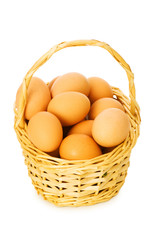 Basket full of eggs isolated on white