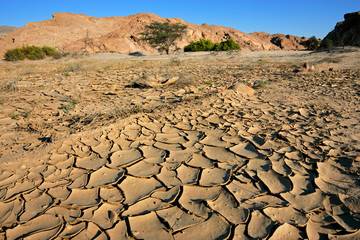 Cracked mud in a dry riverbed, Namibia, southern Africa