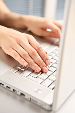 Hands and computer.