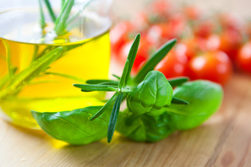 Fresh herbs and olive oil with rosemary