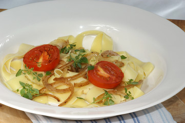 home made tagliatelle with onion and tomato