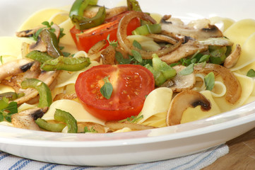 home made tagliatelle with organic tomato and mushroom
