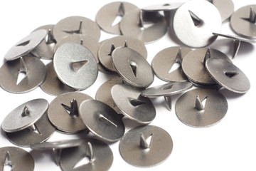 Metal thumbtacks close-up