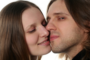 Portrait of young couple in studio isolated on white background