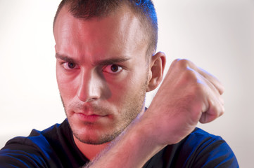 Fototapeta premium Young serious gesturing man