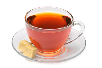 Cup of tea with lump of sugar on a white background