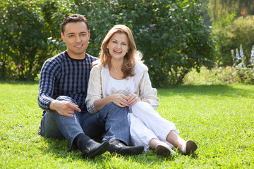 man and woman in braces laughing outdoors