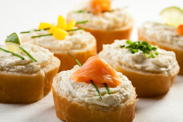 Mini sandwiches - bread with cream cheese and salmon