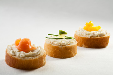 Mini sandwiches - bread with cream cheese and salmon