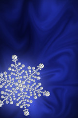 Diamond snowflake on a blue silk.