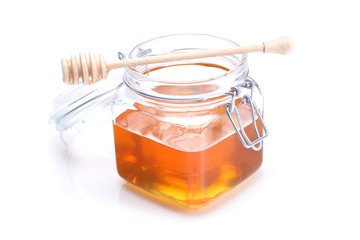 Jar of honey and dipper