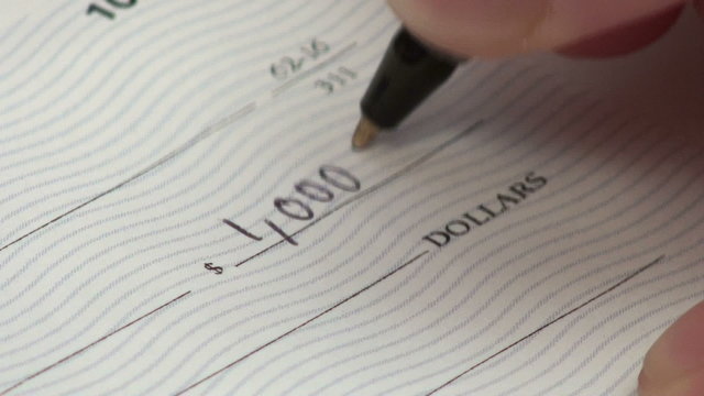 Writing check for one thousand dollars - HD