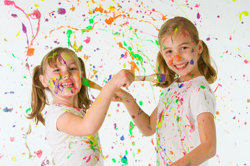 Cute Kids Painting Each Other