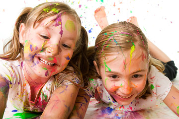 Two children making a big mess