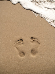 footprints on sand beach
