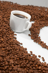 Cup with coffee, costing on coffee grain