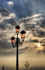 Obraz premium Vintage lamppost at sunrise.