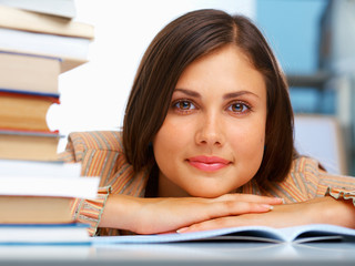 Close-up of a female student with a books