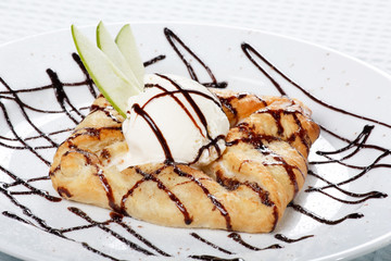 apple  cake and ice-cream on a white plate