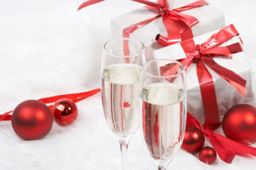 Christmas gift with tapes and a bottle of champagne