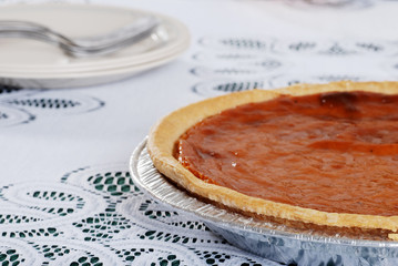 pumpkin pie with plates