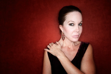 Fototapeta premium Beautiful Woman on a Red Background