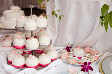 Table decorated with wedding cakes