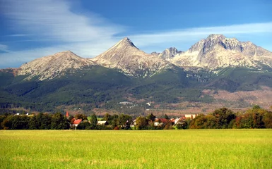 Keuken foto achterwand Tatra A view of The Tatra Mountains and village in summer, Slovakia.