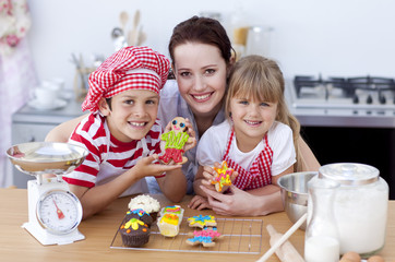 Mother baking with children in the kitchen