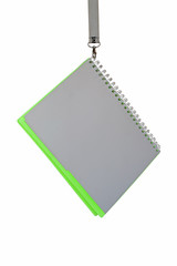Abstract: a notebook hanging on a snap-hook, studio shot